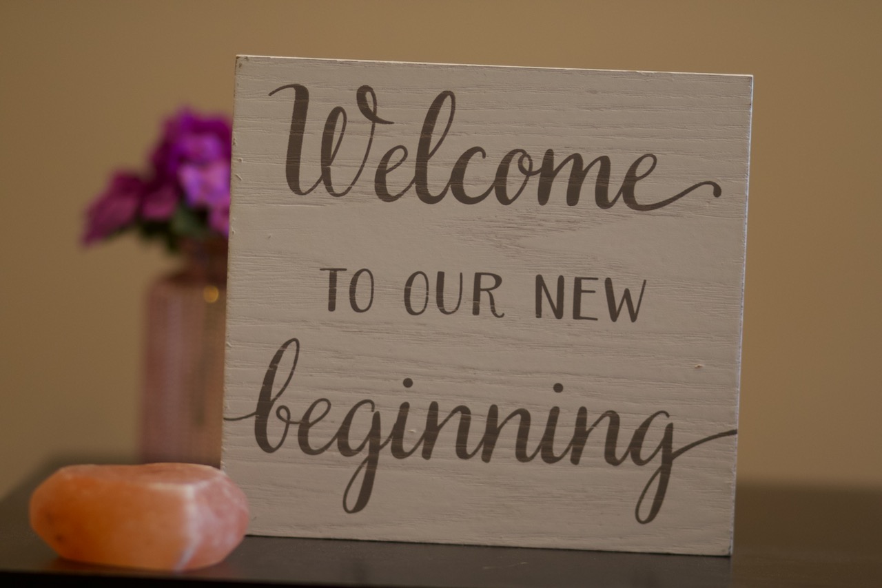 Reception area with welcome sign and flowers